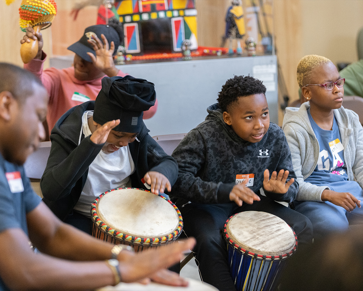 Kids playing hand drums together